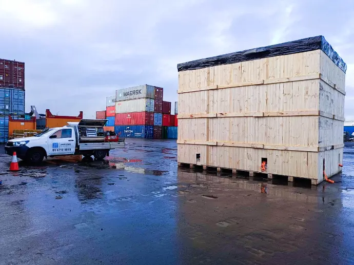 large wooden shipping crate and ute